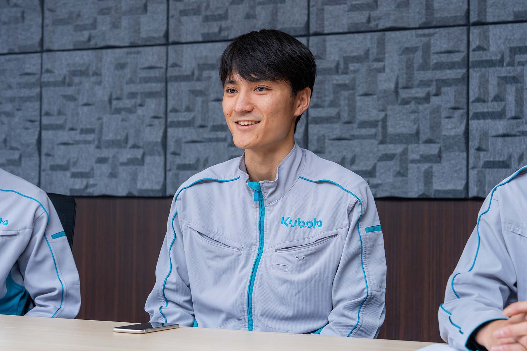 Yutaro Yoshida answers interview questions in a conference room.