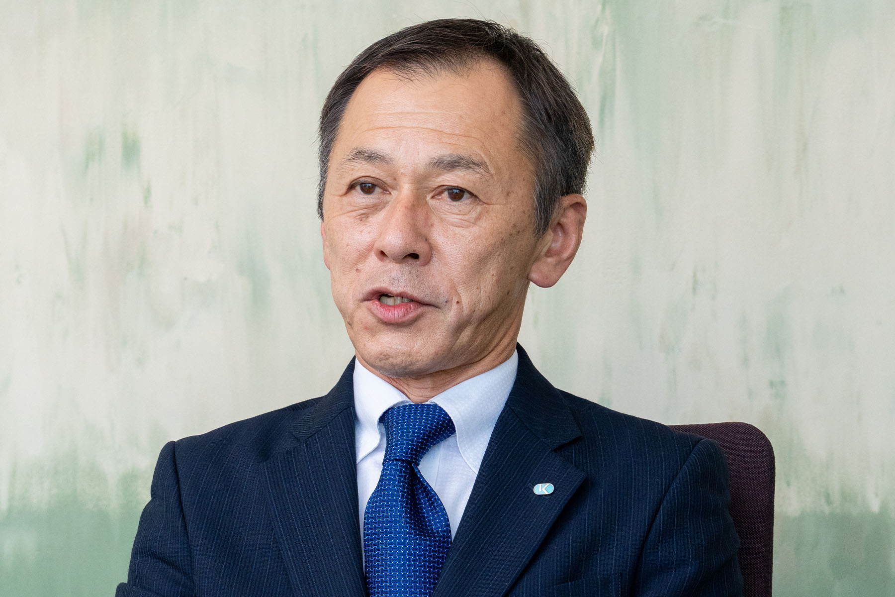 Shinya Tsuruda is interviewed in a conference room at Kubota's head office.